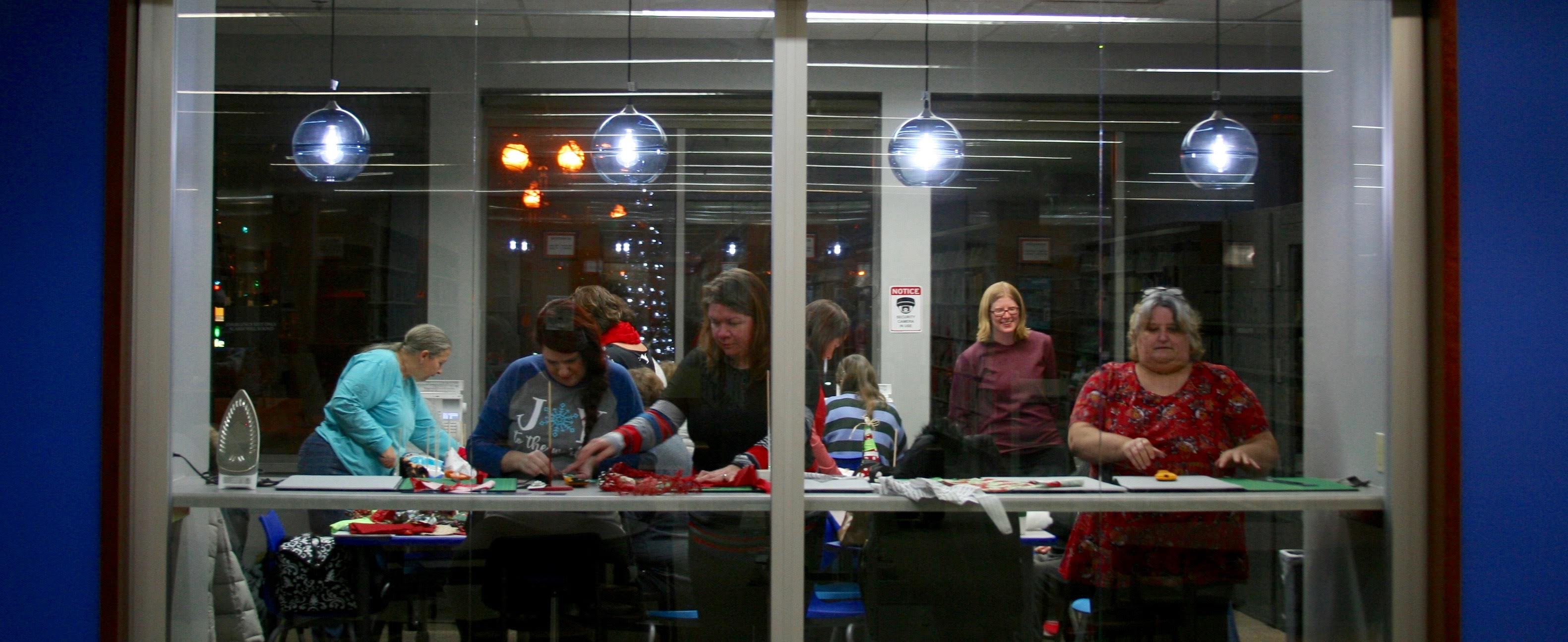 Patrons participating in Christmas craft event inside the Idea Box