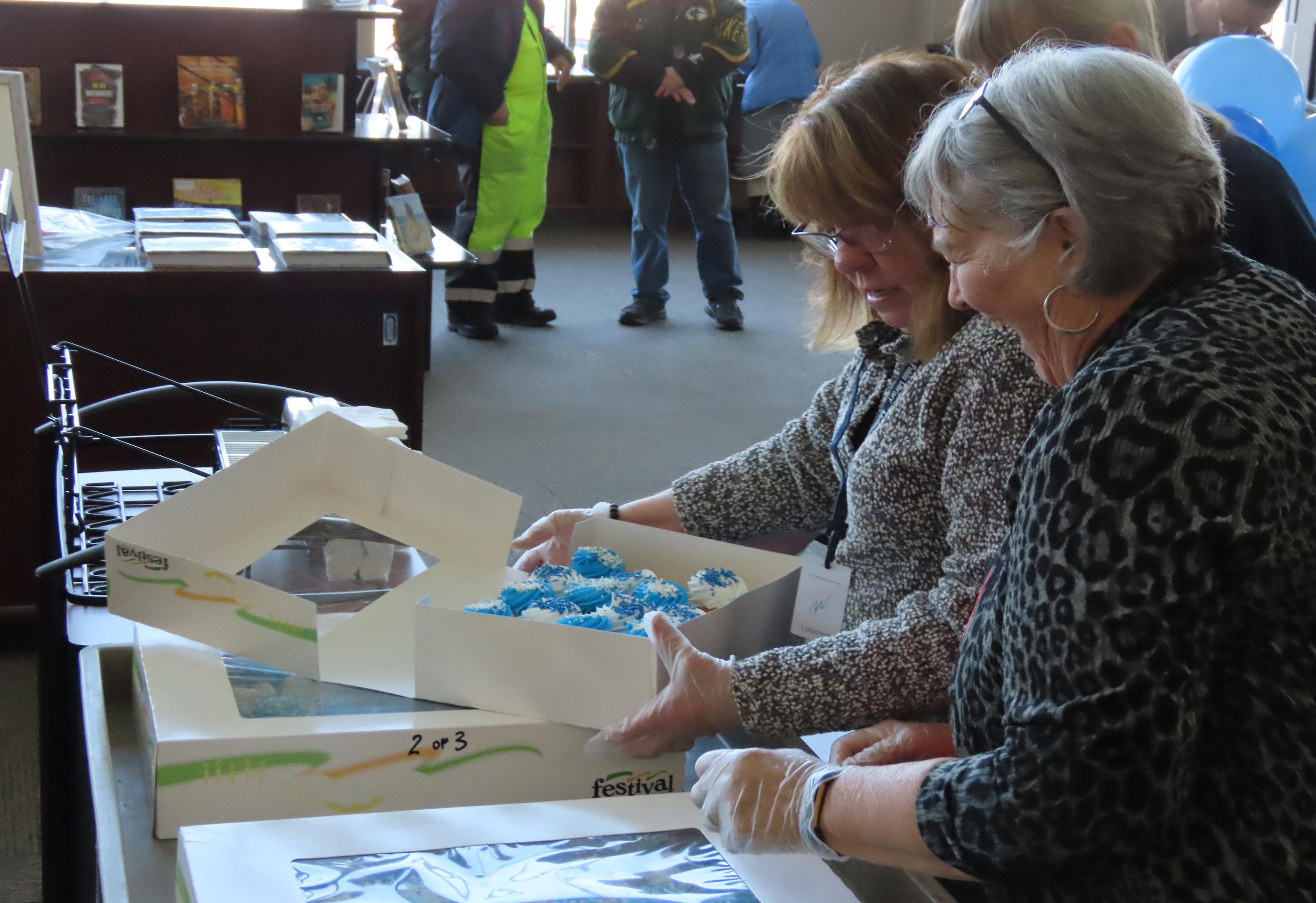 Cupcake volunteers packing boxes