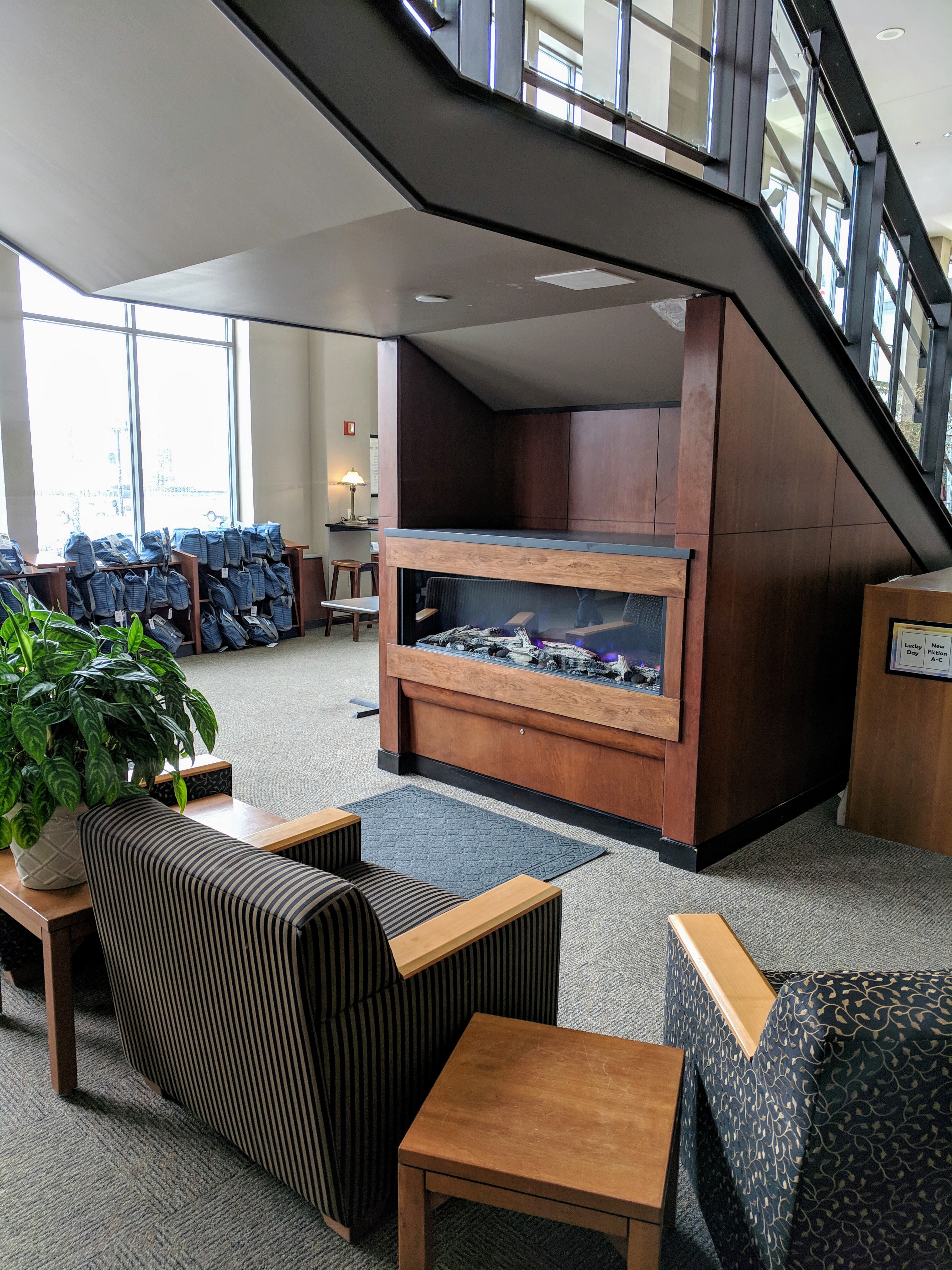 Fireplace with seating below stairwell