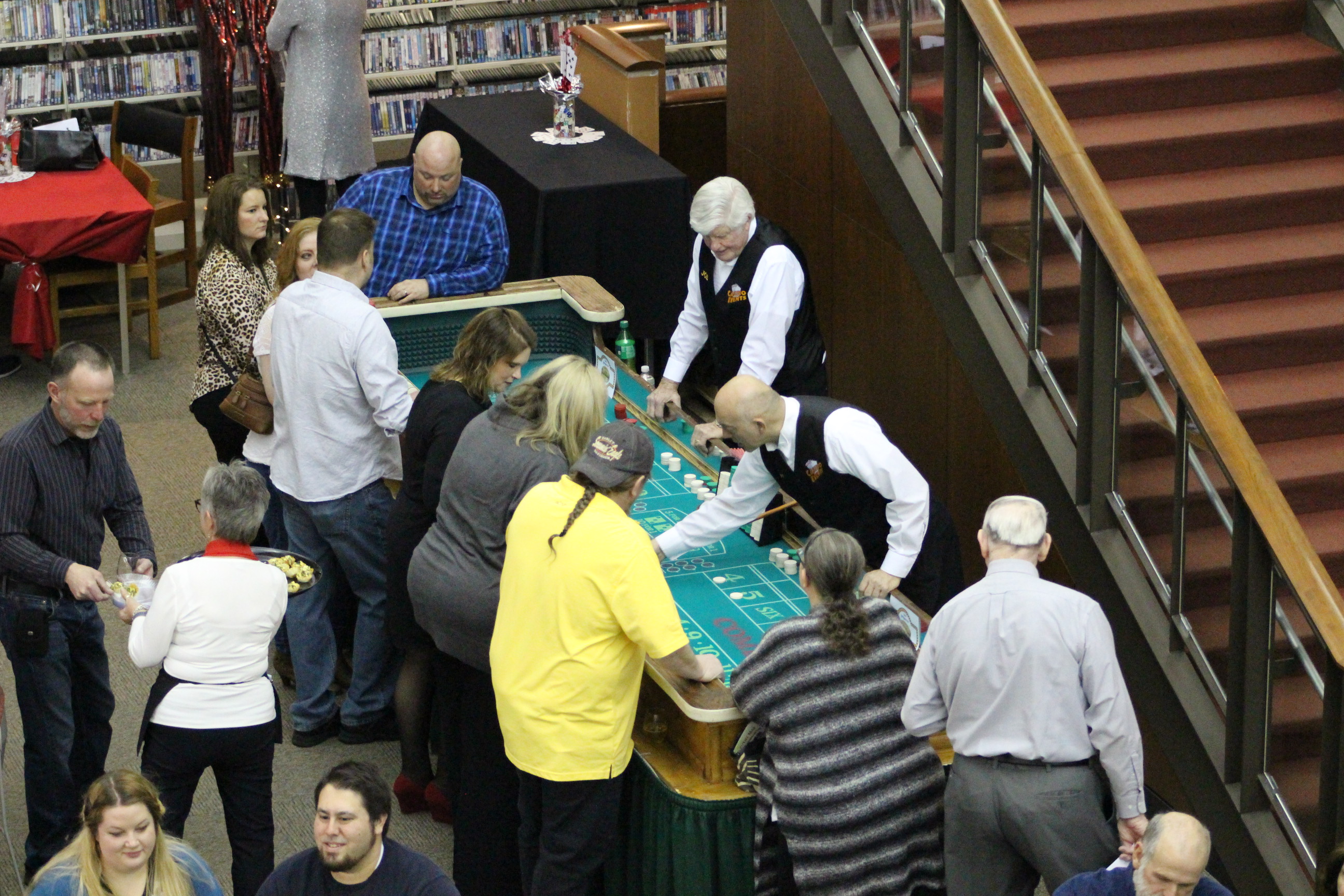 Participants playing at casino game table