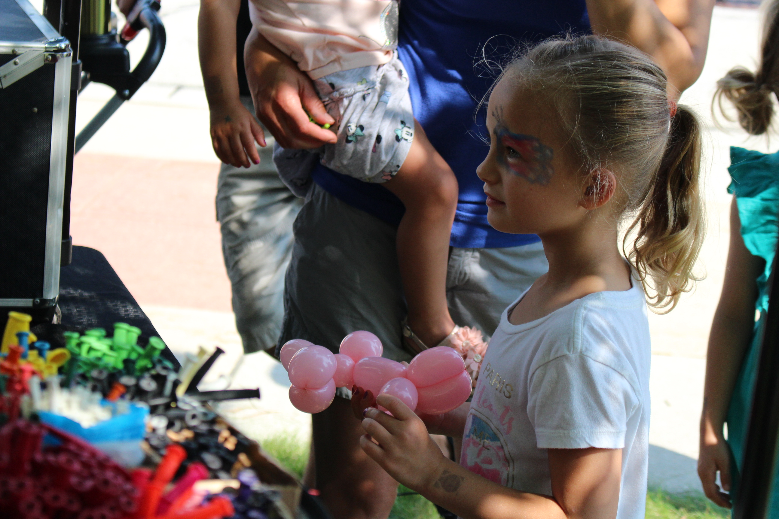 Girl holding balloon animal