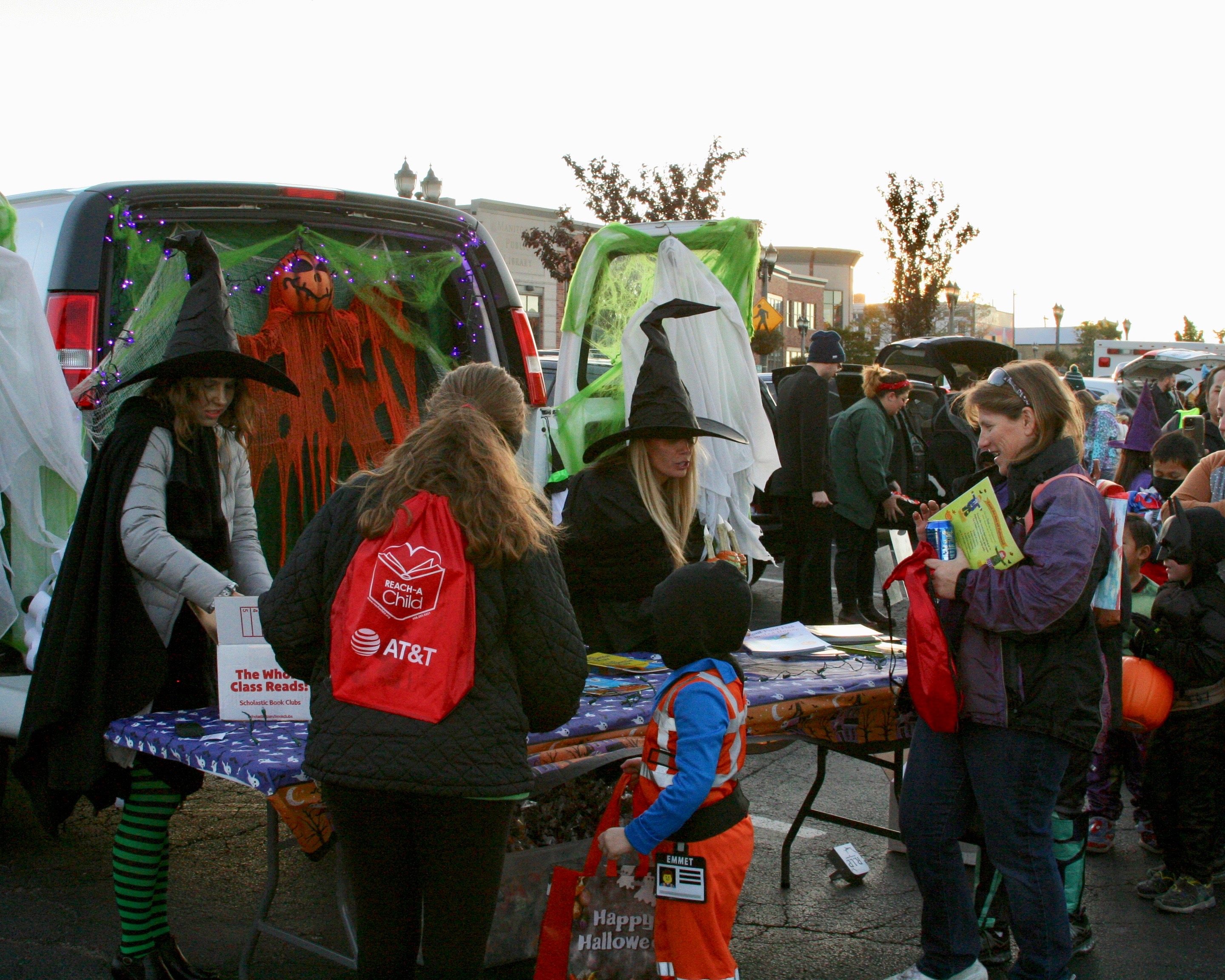 People at library trunk or treat table