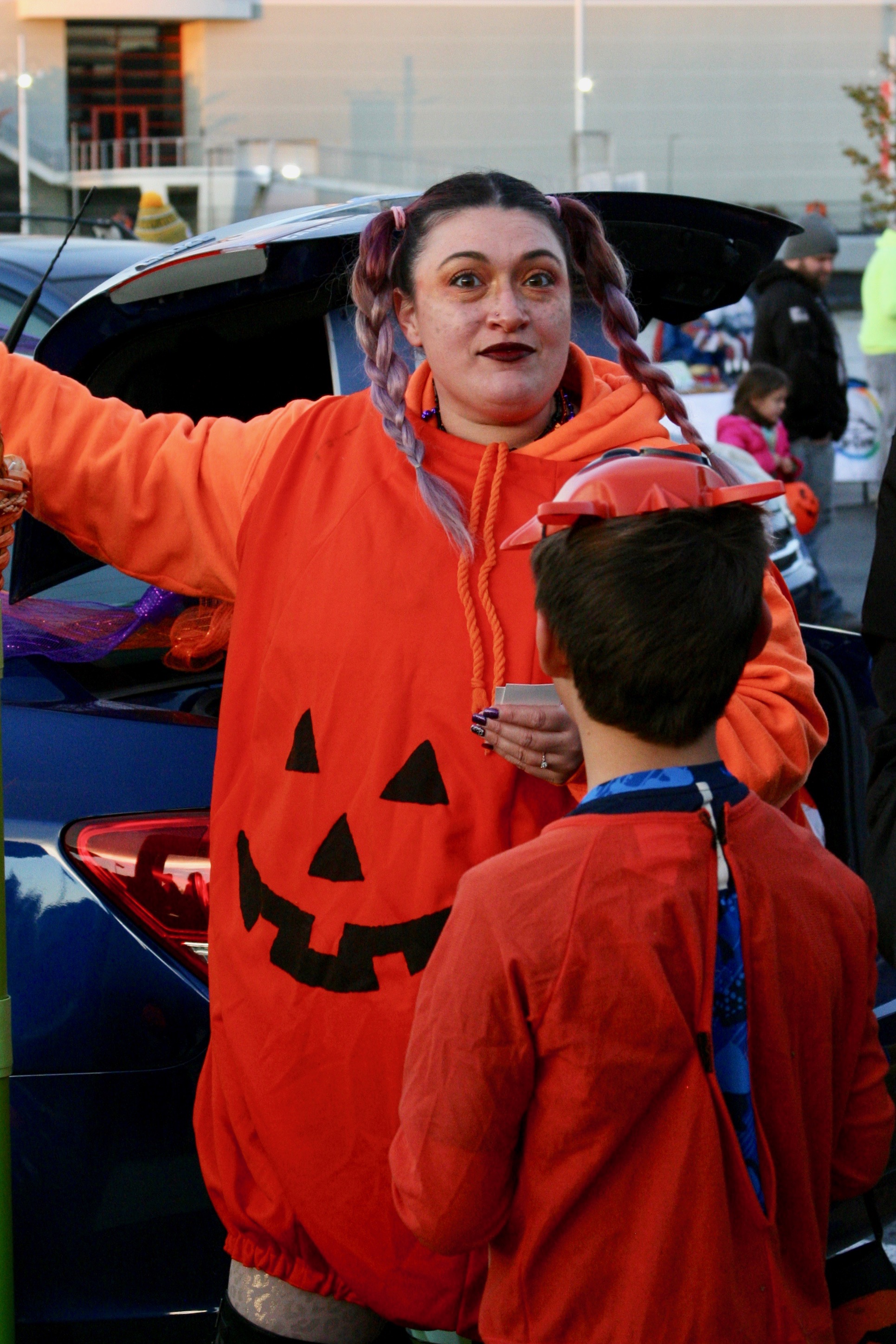 Woman dressed in pumpkin jumpsuit