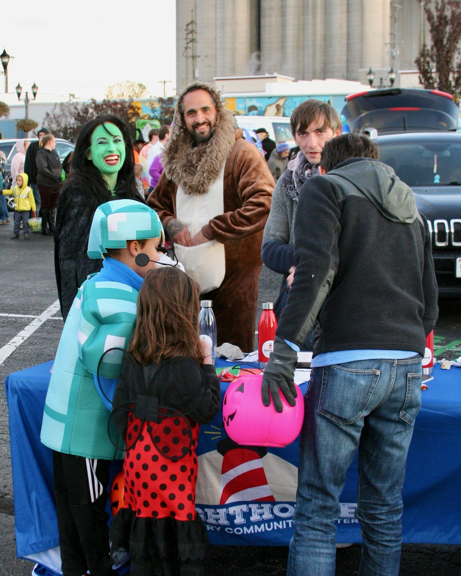 Participants stand near event table