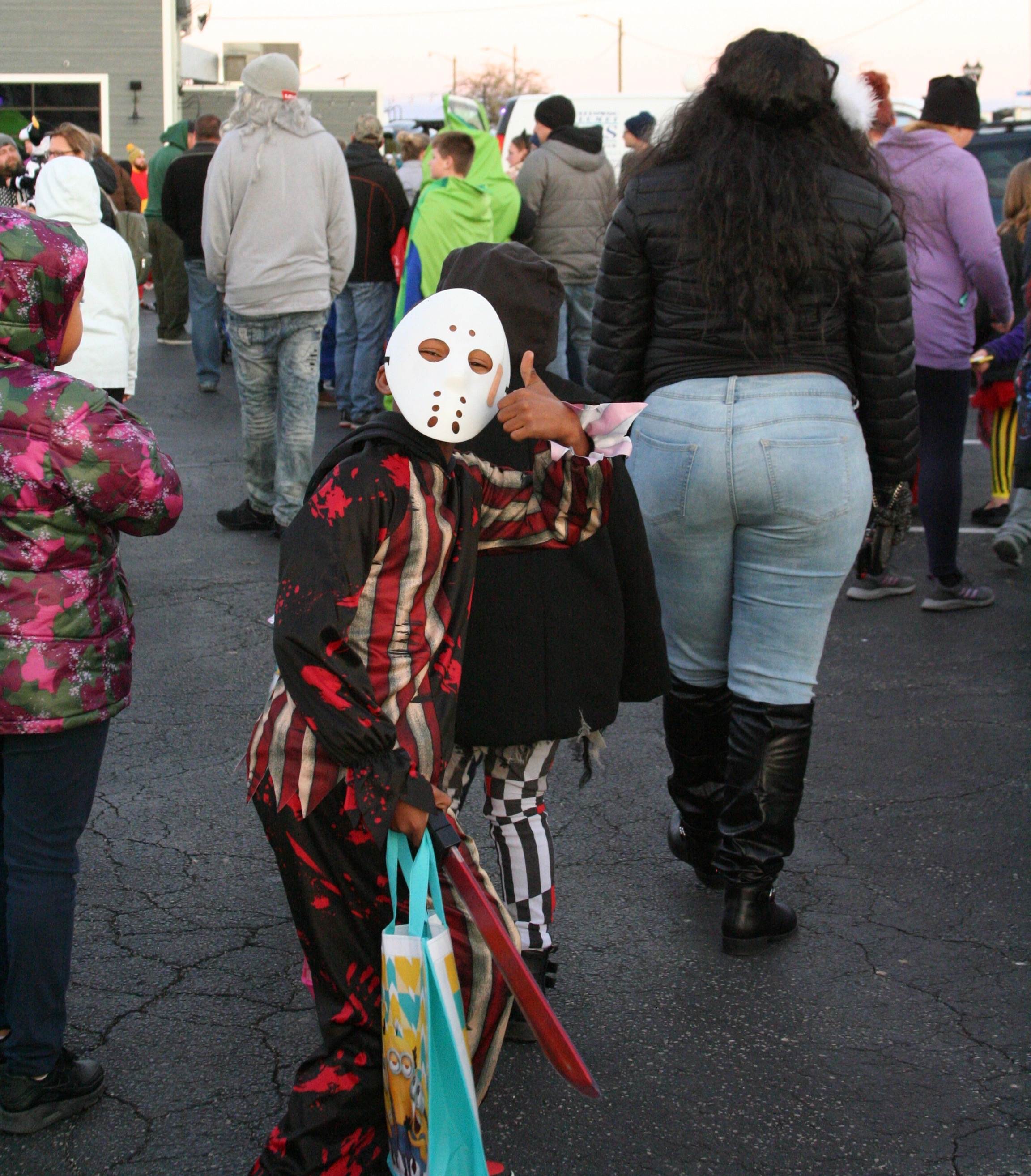 Child wearing hockey mask costume