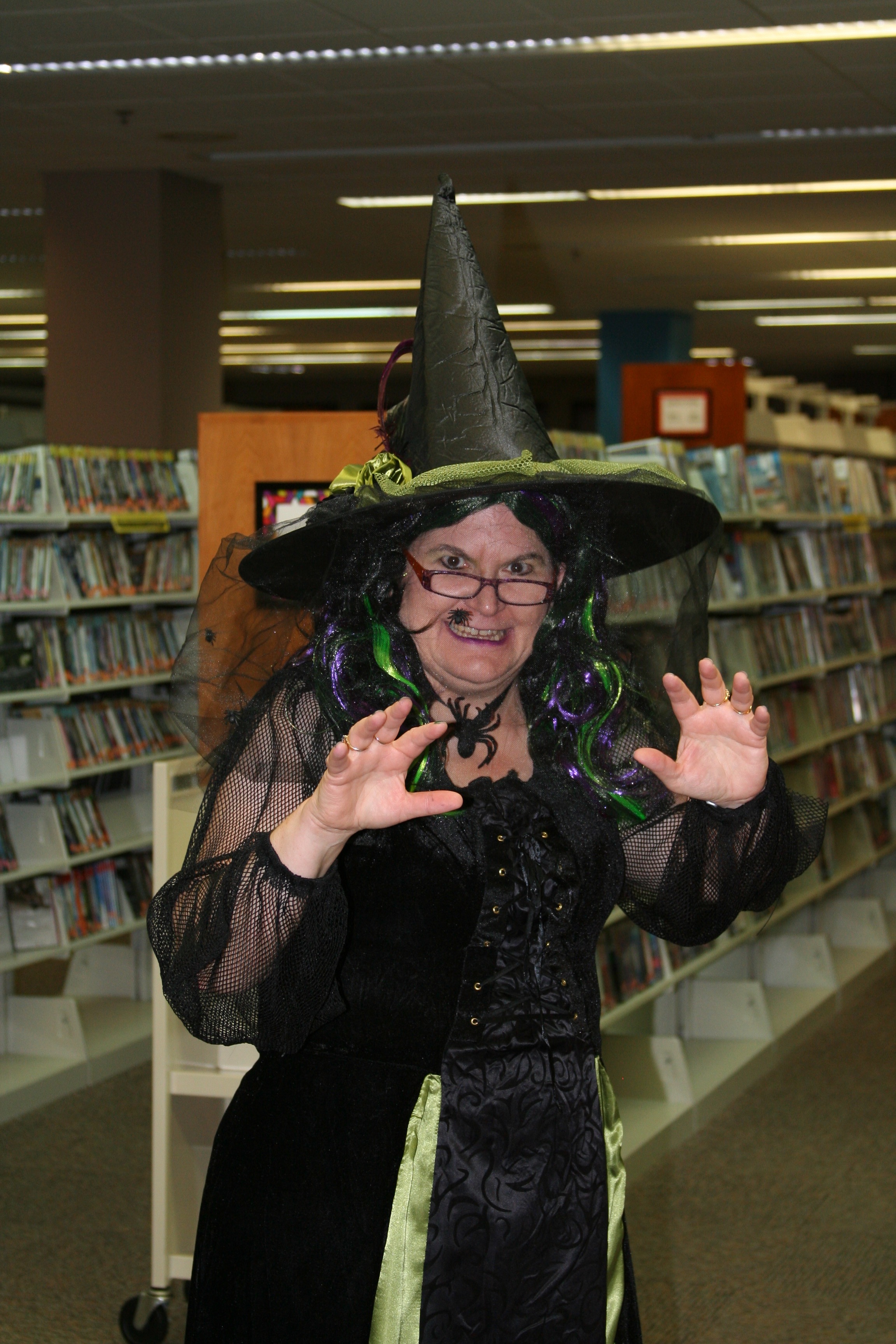 Woman dressed as witch inside the library