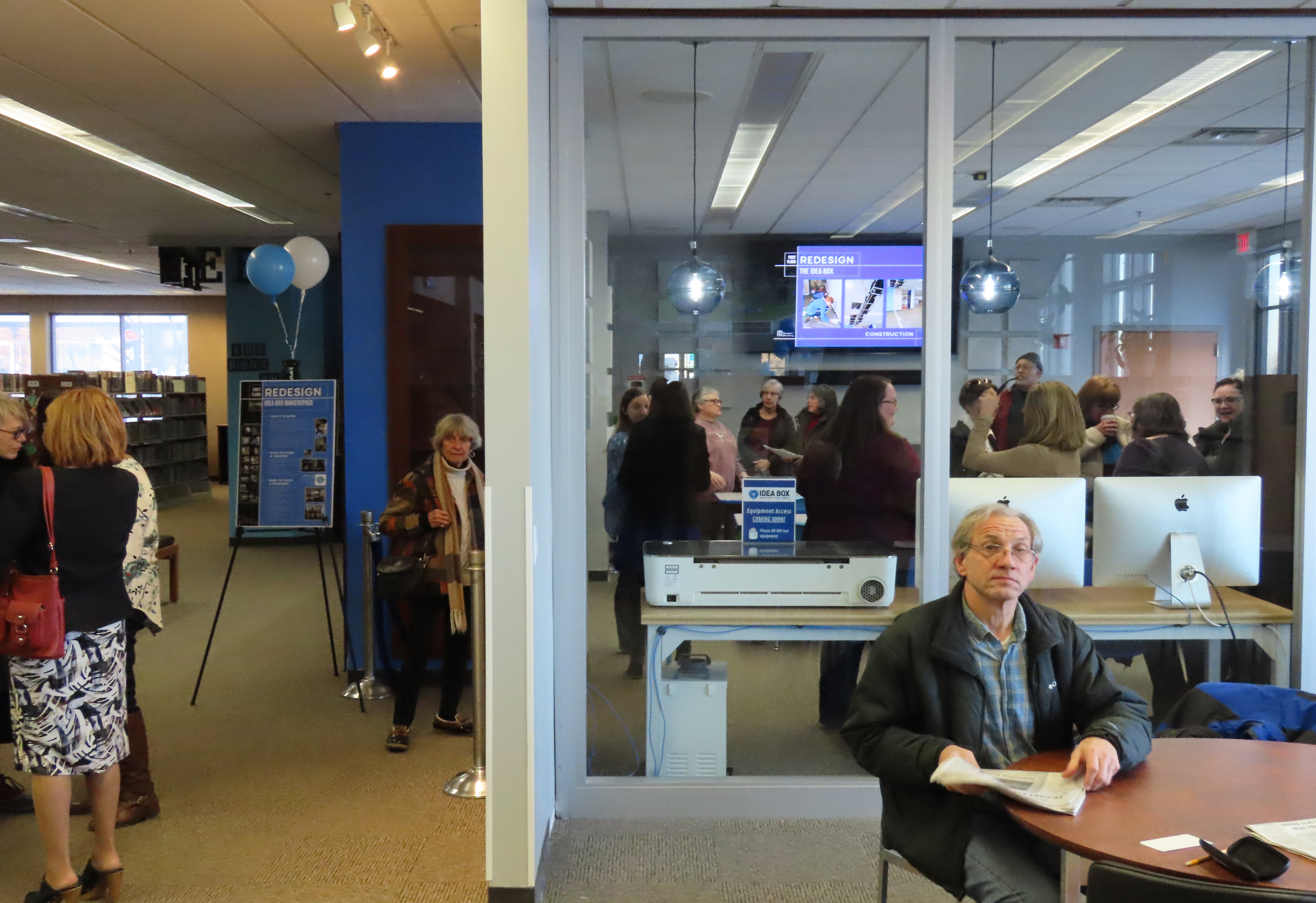 Participants at ribbon cutting touring the Idea Box Makerspace