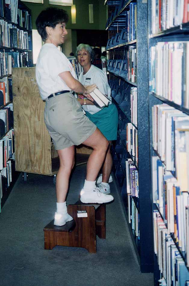 woman moving books