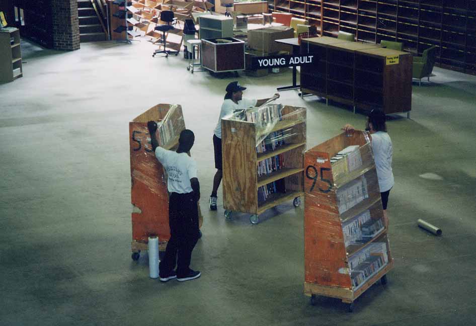 staff moving shelves