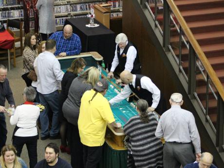 Participants playing at casino game table
