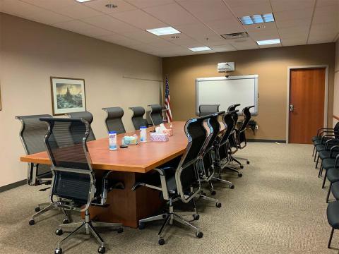 Front view of conference table and chairs in the Board Room