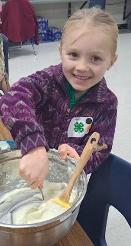 Photo of child with a mixing bowl
