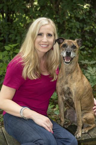 Photo of Jennifer Brandt and her therapy dog, Camilla