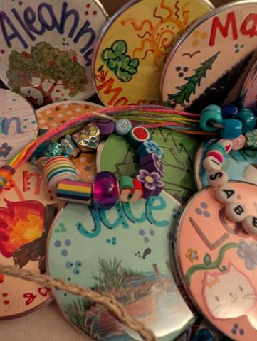 Photo of beaded bracelets and name buttons