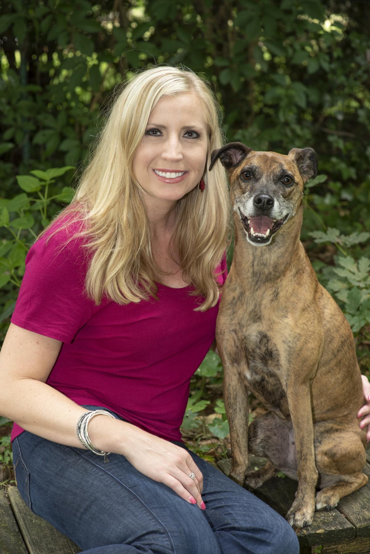 Photo of Jennifer Brandt and her therapy dog, Camilla